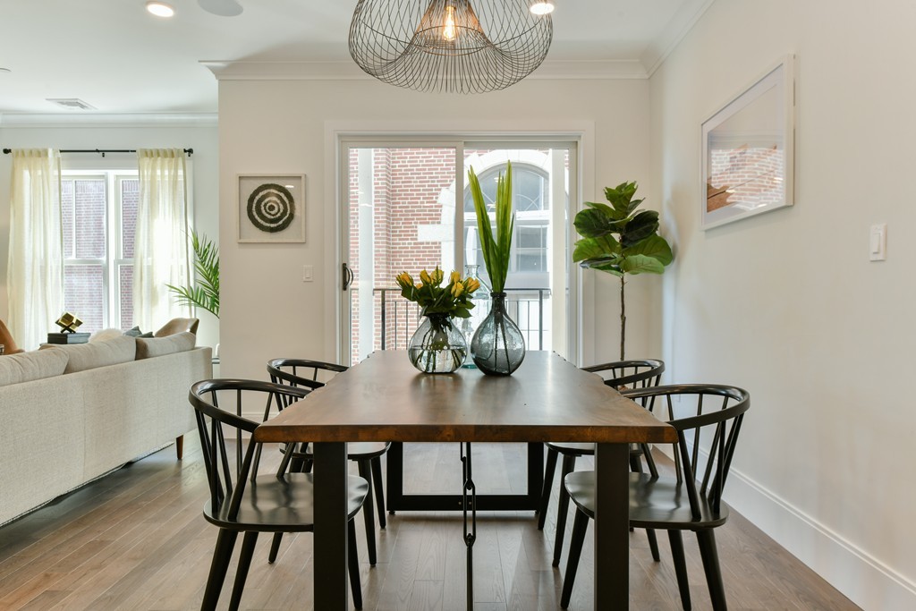 10 Sydney Street, Unit 7 Boston, MA 02125 - Photo 21 of 26 a view of a dining room with furniture window and wooden floor