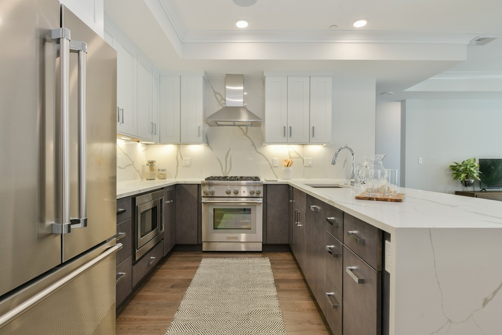 10 Sydney Street, Unit 7 Boston, MA 02125 - Photo 24 of 26 a kitchen with a sink stove and refrigerator