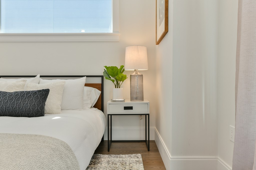 10 Sydney Street, Unit 7 Boston, MA 02125 - Photo 5 of 26 a bedroom with a bed and window