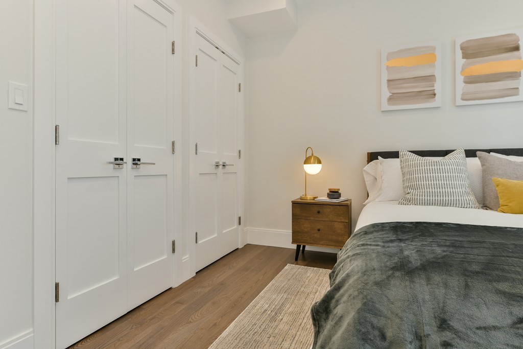 10 Sydney Street, Unit 7 Boston, MA 02125 - Photo 8 of 26 a bedroom with a bed and a window