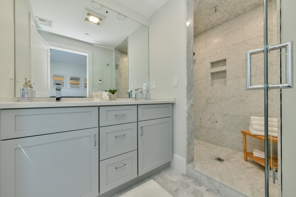 10 Sydney Street, Unit 7 Boston, MA 02125 - Photo 10 of 26 a bathroom with a double vanity sink mirror and shower