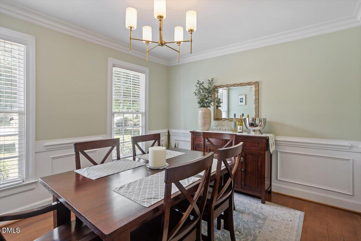 1808 Thorpshire Drive Raleigh, NC 27615 - Photo 8 of 17 a view of a dining room with furniture and wooden floor