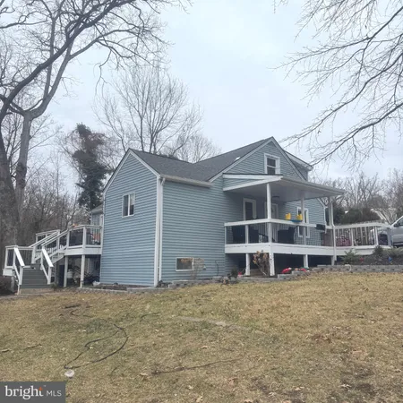 a view of a house with a yard and garage