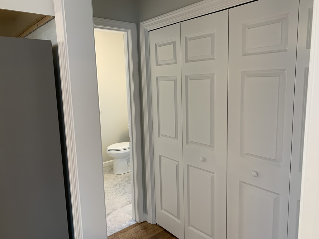 11 Mendon Road, Unit A Attleboro, MA 02703 - Photo 14 of 24 a view of bathroom with a toilet sink
