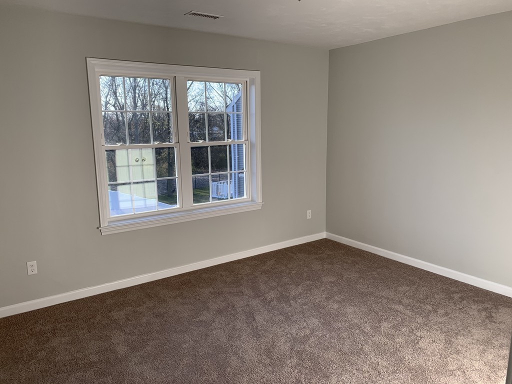 11 Mendon Road, Unit A Attleboro, MA 02703 - Photo 20 of 24 an empty room with a window