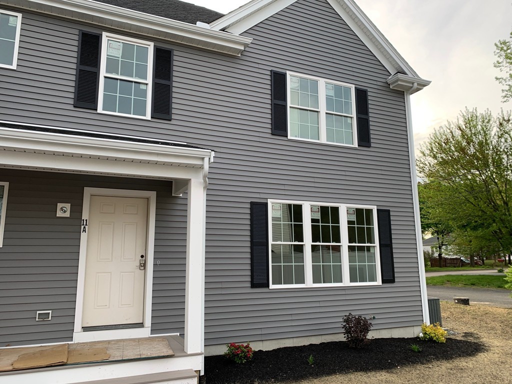 11 Mendon Road, Unit A Attleboro, MA 02703 - Photo 3 of 24 a side view of a house