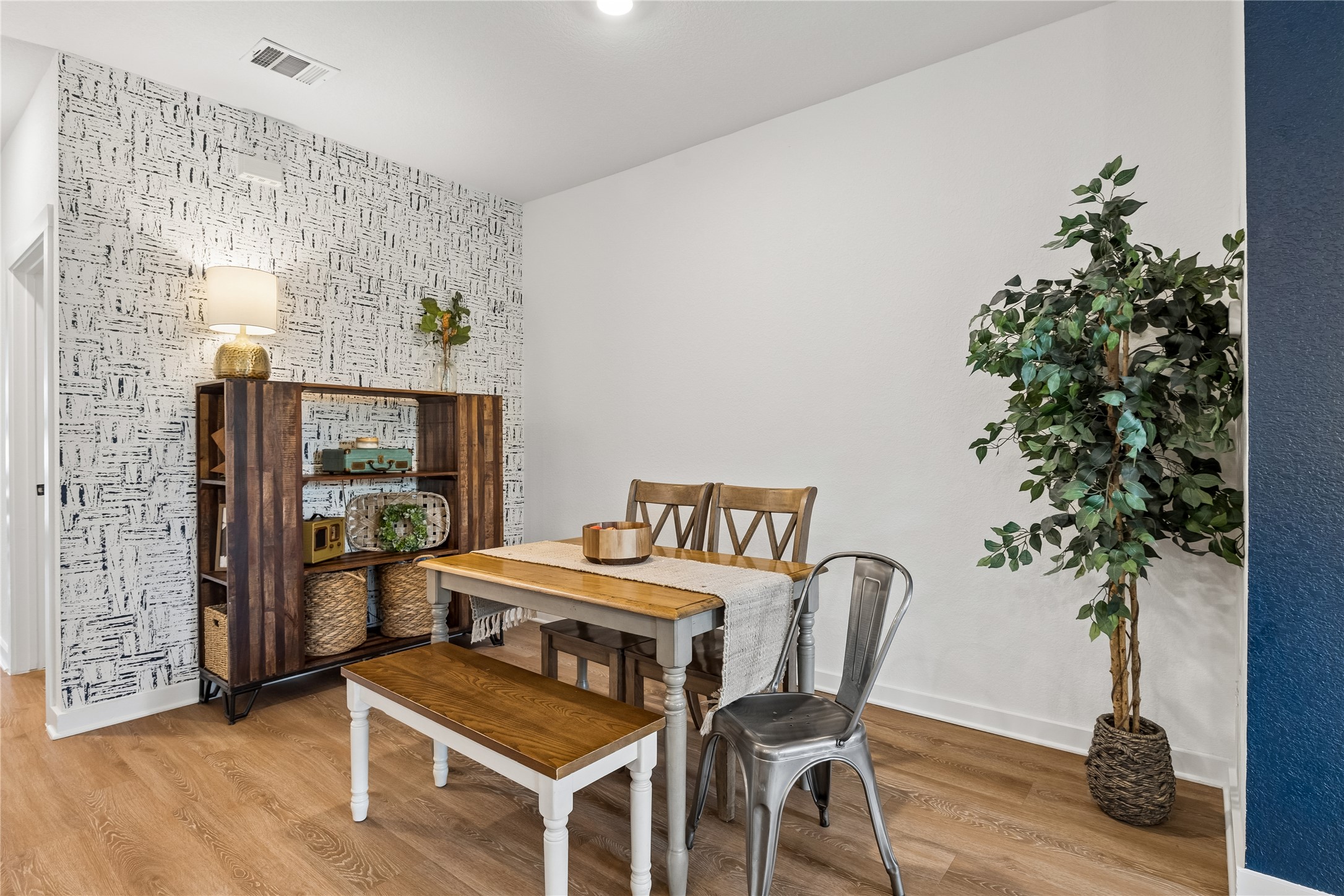 249 Century Plant Road Leander, TX 78641 - Photo 4 of 22 a kitchen with a table and chairs in it