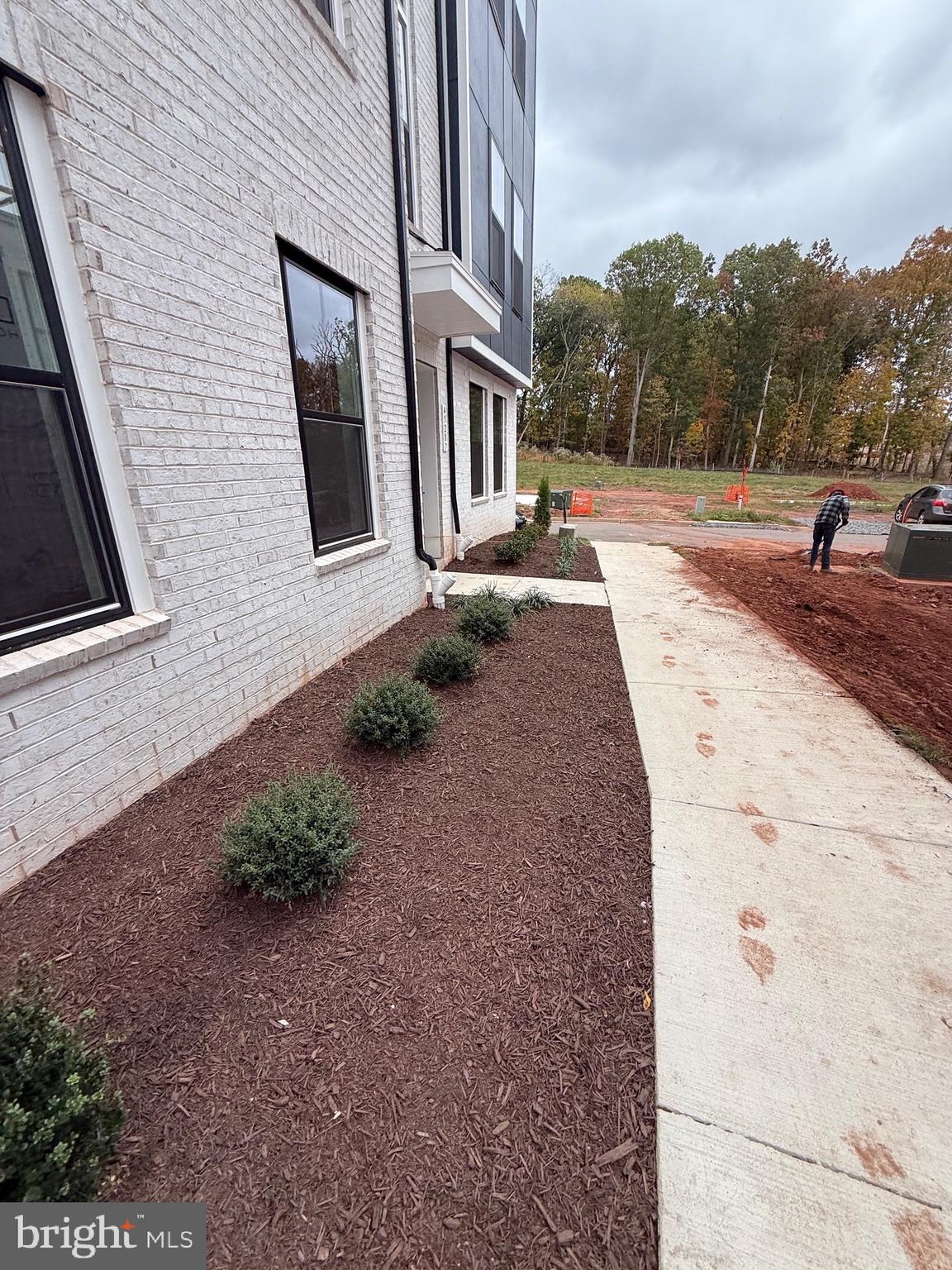 45203 Drowes Terrace Sterling, VA 20166 - Photo 4 of 19 a front view of a house with a yard