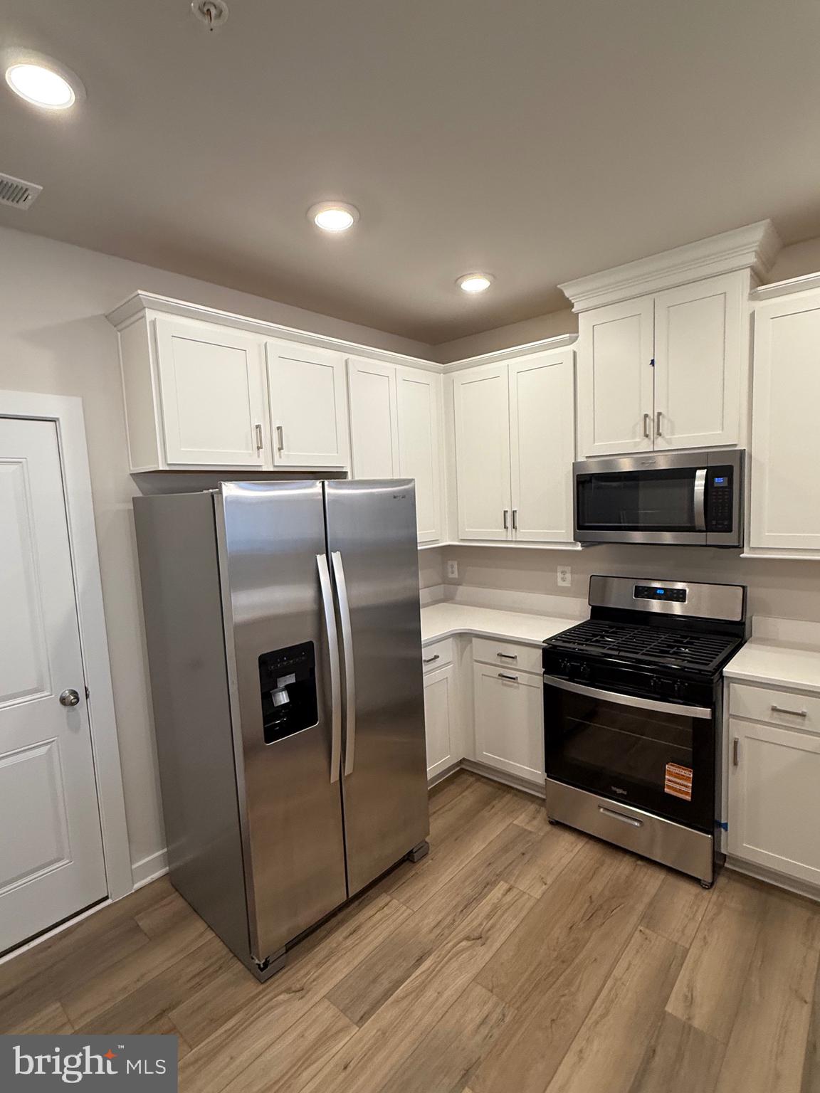 45203 Drowes Terrace Sterling, VA 20166 - Photo 8 of 19 a kitchen with stainless steel appliances a refrigerator stove and sink