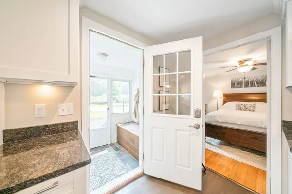 a kitchen with granite countertop a sink and a stove