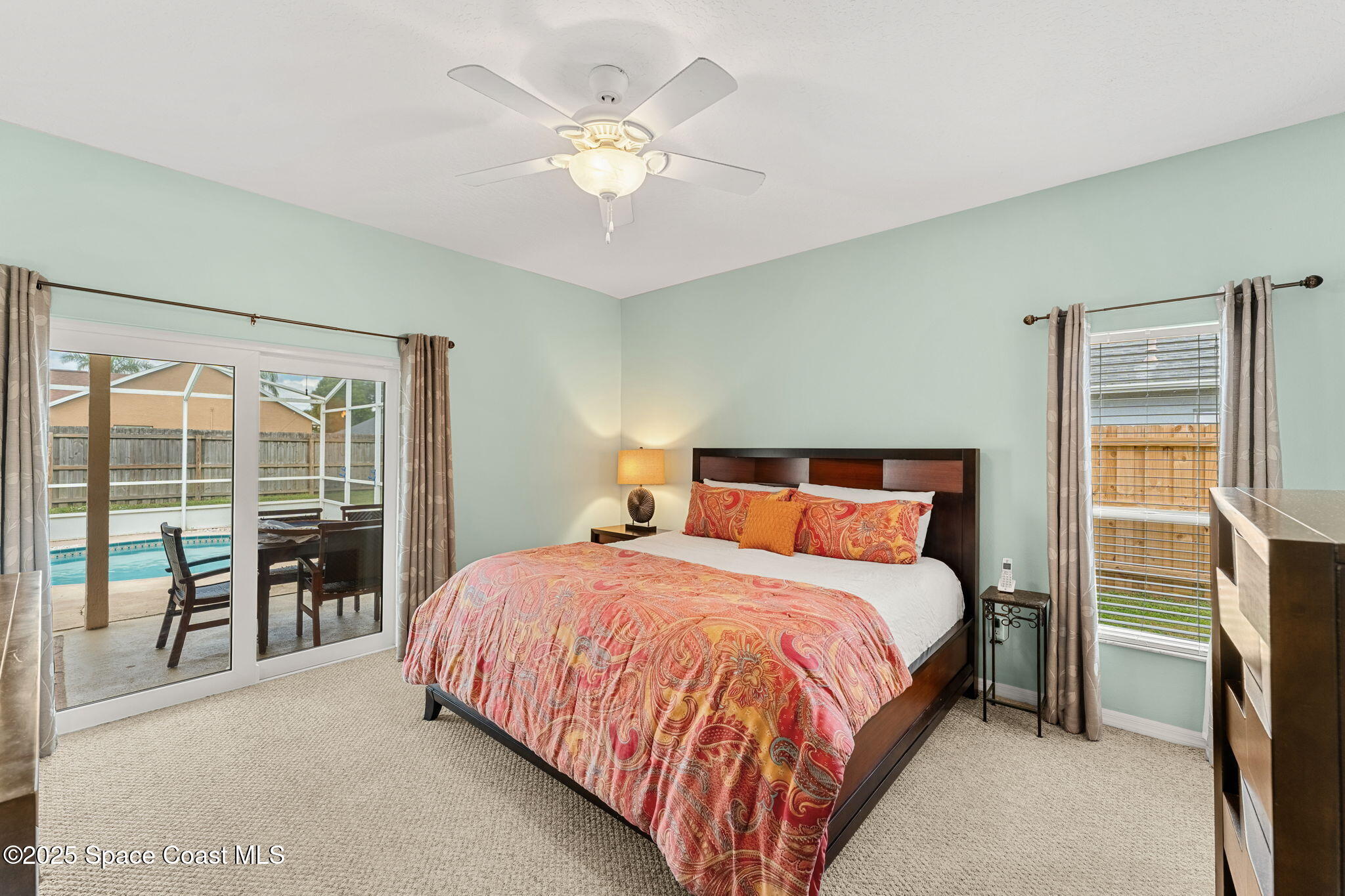 1020 Pelican Lane Rockledge, FL 32955 - Photo 14 of 36 a bedroom with a bed and a large window