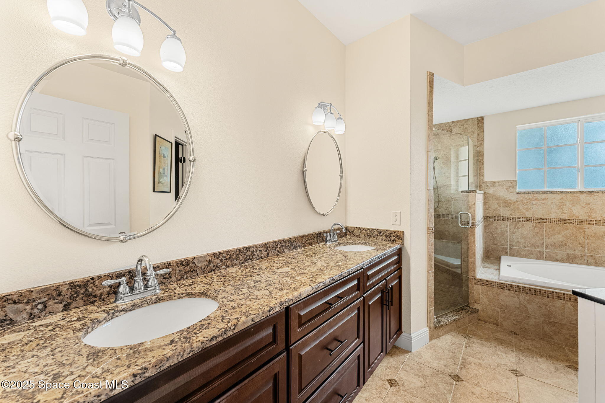 1020 Pelican Lane Rockledge, FL 32955 - Photo 16 of 36 a bathroom with a granite countertop double vanity sink and a mirror