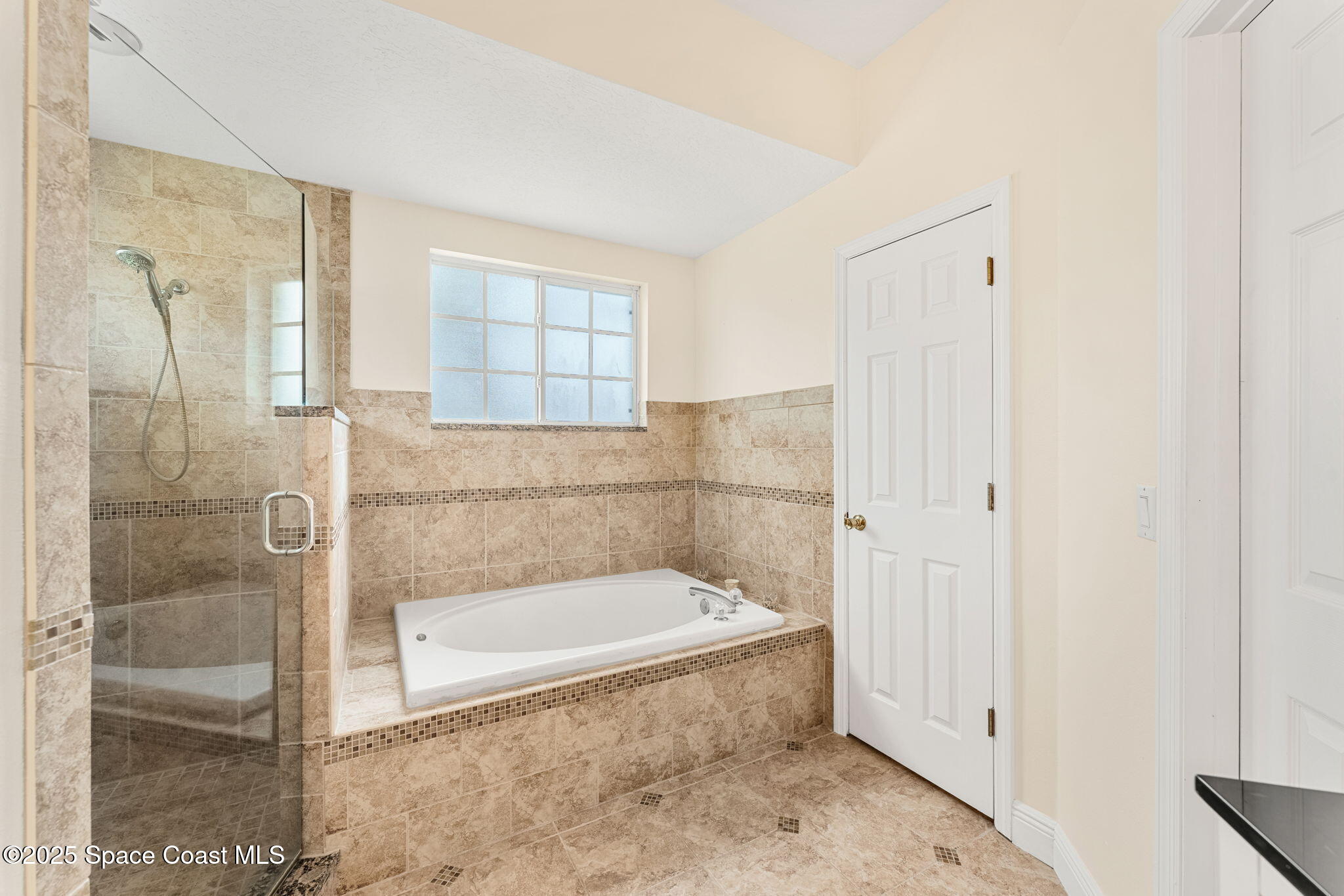 1020 Pelican Lane Rockledge, FL 32955 - Photo 17 of 36 a bathroom with a bathtub and a shower