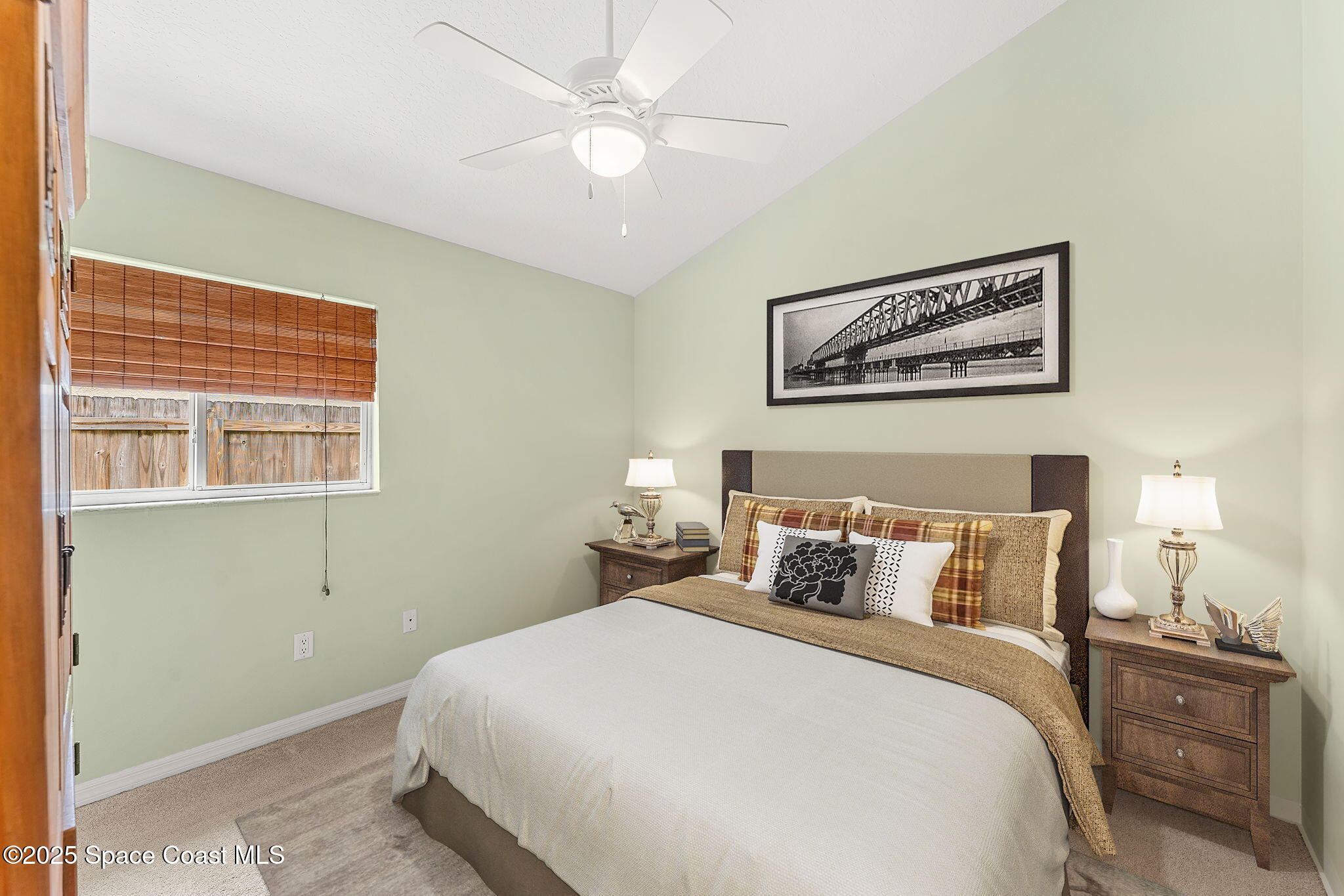 1020 Pelican Lane Rockledge, FL 32955 - Photo 18 of 36 a bedroom with a bed and a painting on the wall