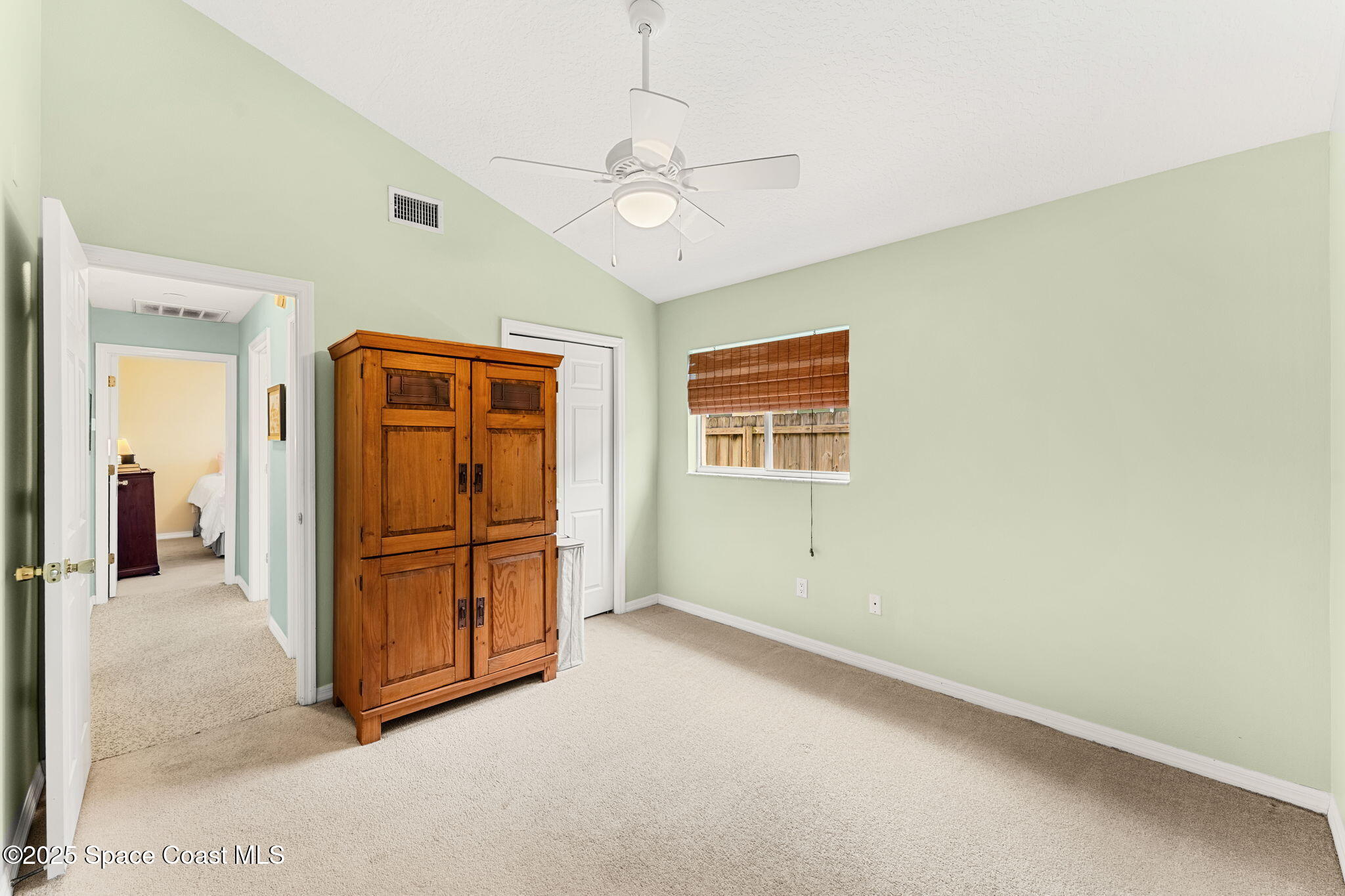 1020 Pelican Lane Rockledge, FL 32955 - Photo 19 of 36 a view of a livingroom with wooden floor and a ceiling fan