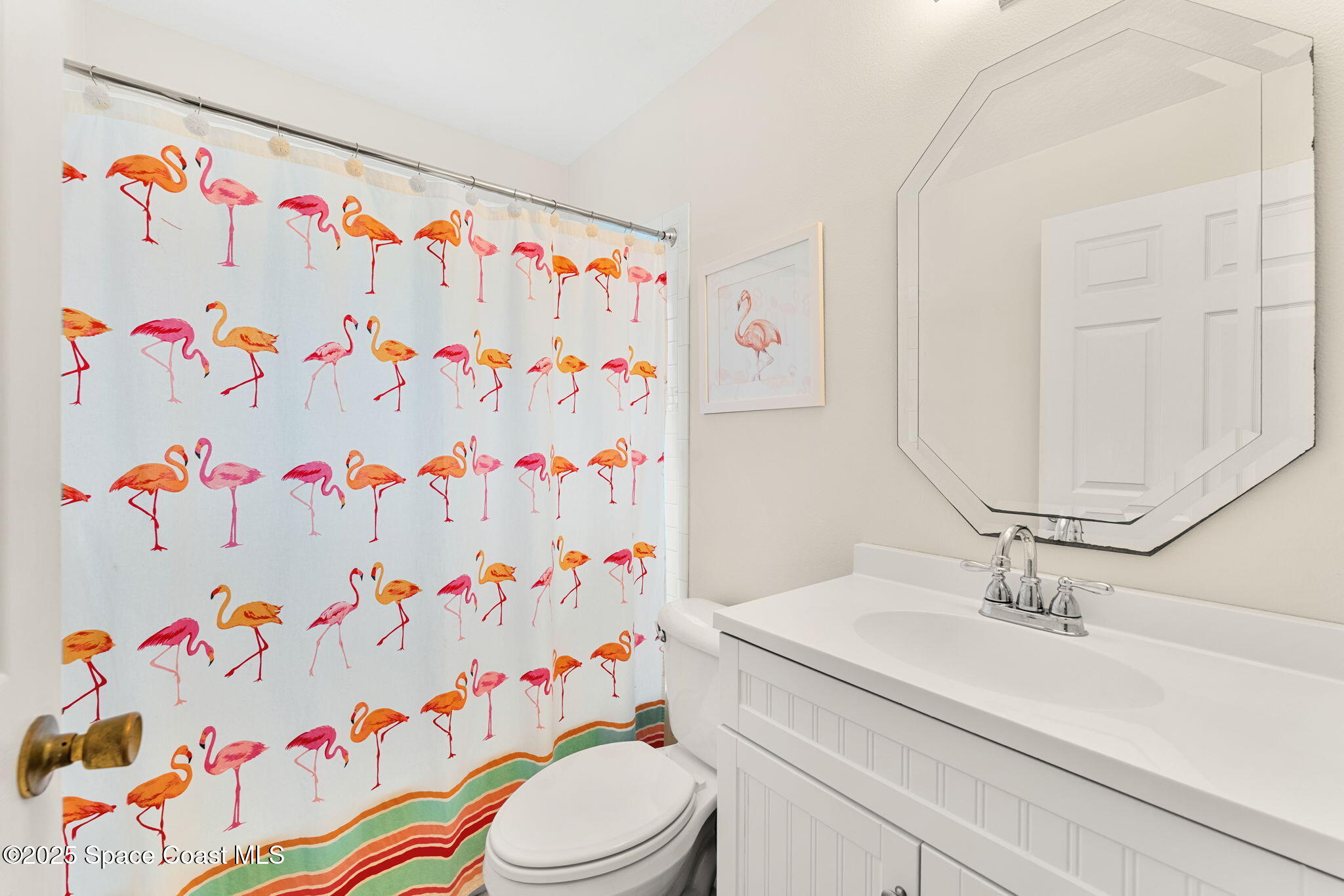 1020 Pelican Lane Rockledge, FL 32955 - Photo 20 of 36 a bathroom with a sink a toilet and curtain