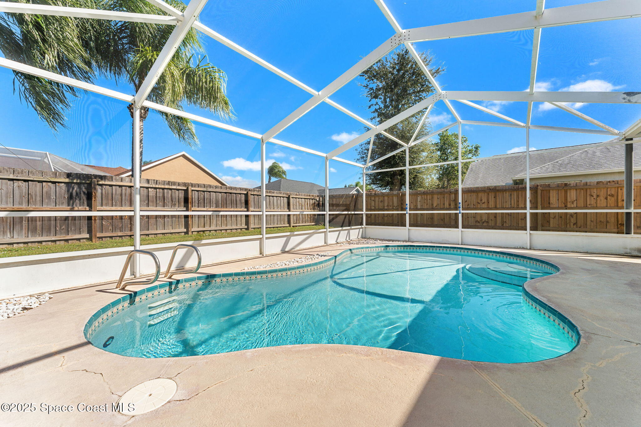 1020 Pelican Lane Rockledge, FL 32955 - Photo 24 of 36 a view of a swimming pool with a lounge chairs
