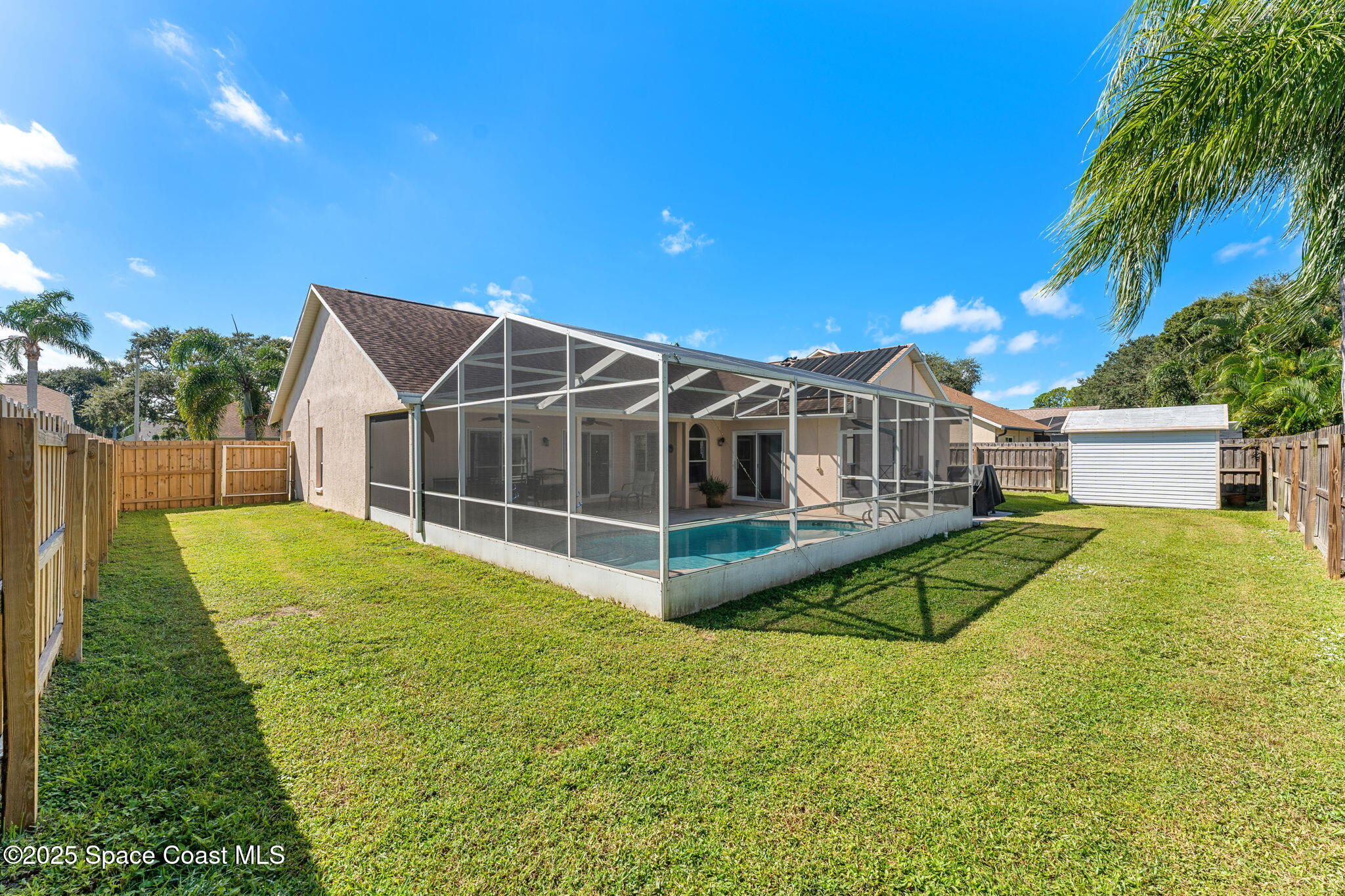1020 Pelican Lane Rockledge, FL 32955 - Photo 28 of 36 a view of a house with a backyard and a patio