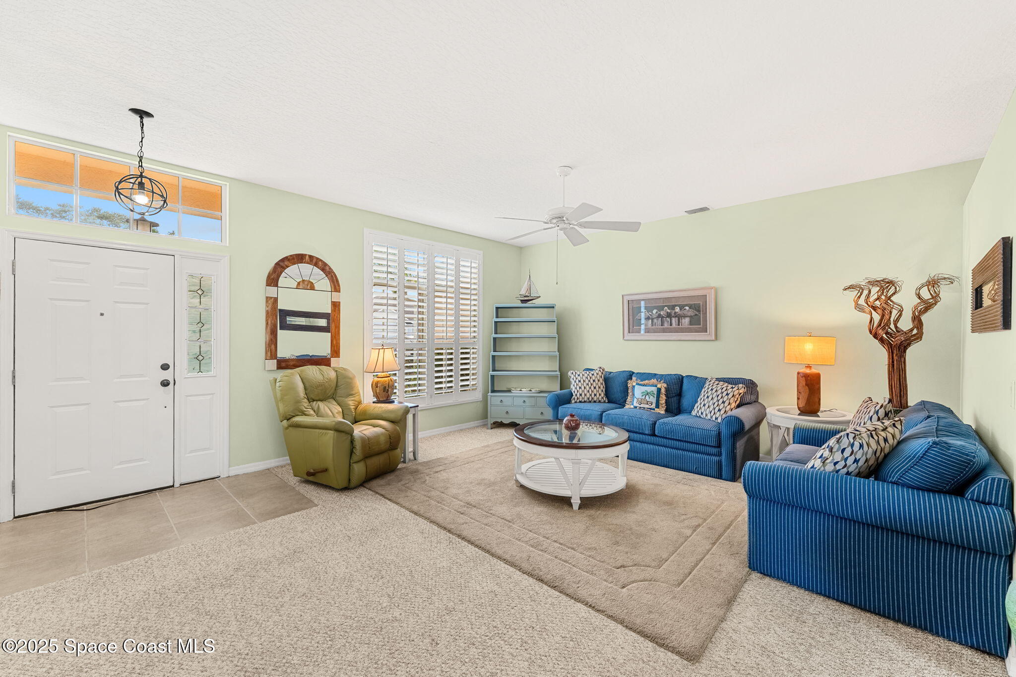 1020 Pelican Lane Rockledge, FL 32955 - Photo 4 of 36 a living room with furniture and a table