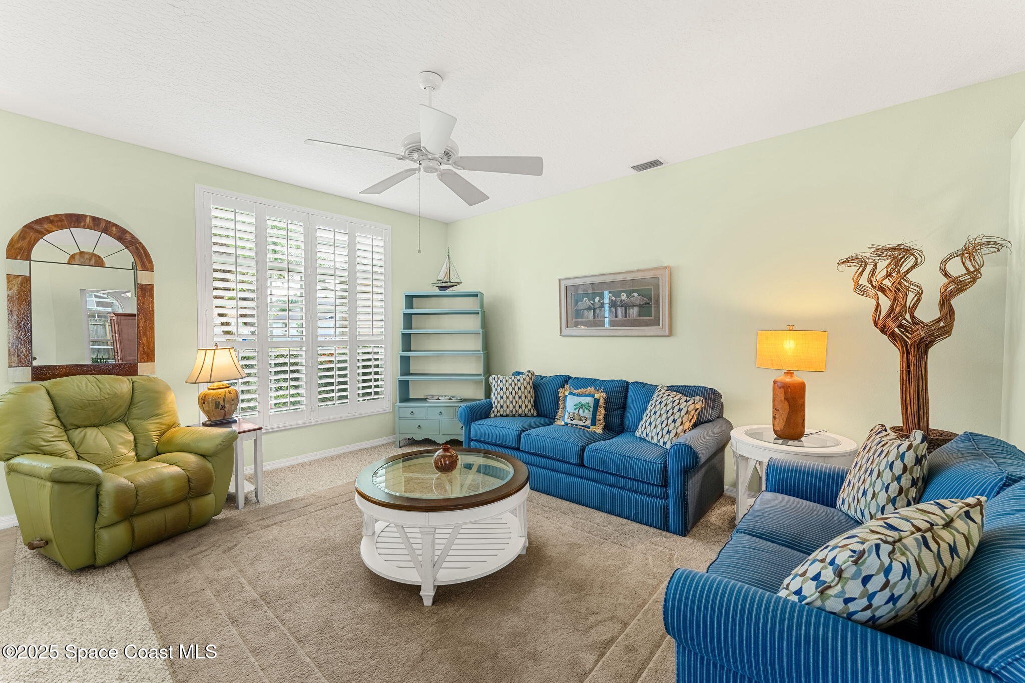 1020 Pelican Lane Rockledge, FL 32955 - Photo 5 of 36 a living room with furniture and a large window