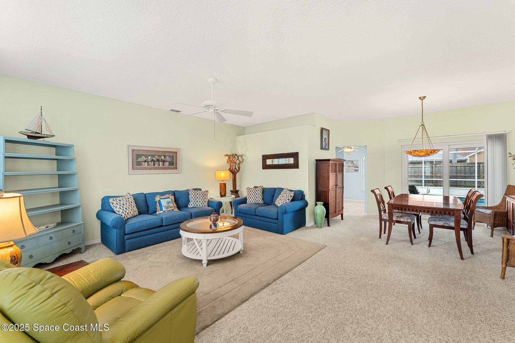 1020 Pelican Lane Rockledge, FL 32955 - Photo 6 of 36 a living room with furniture and a wooden floor
