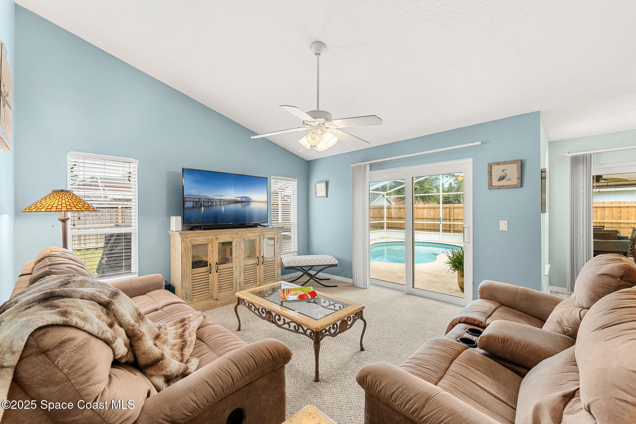 1020 Pelican Lane Rockledge, FL 32955 - Photo 8 of 36 a living room with furniture and a flat screen tv