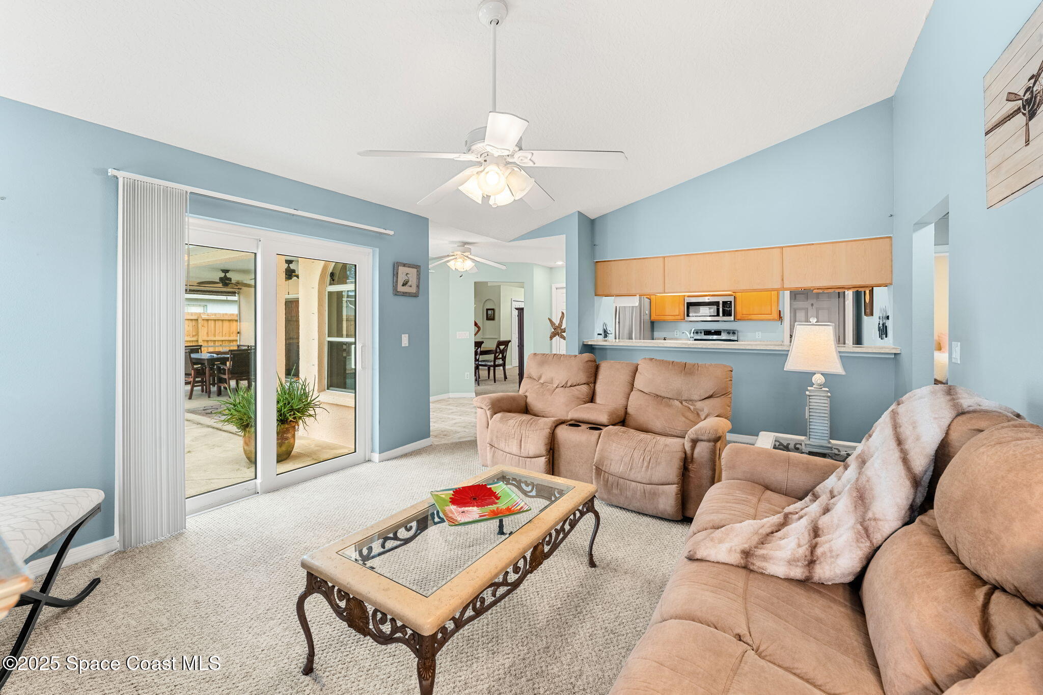 1020 Pelican Lane Rockledge, FL 32955 - Photo 9 of 36 a living room with furniture and a large window