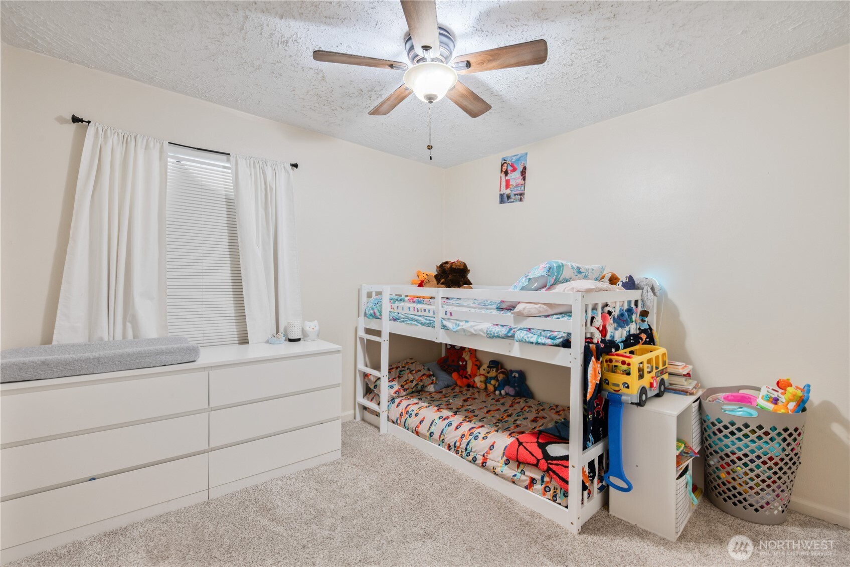 467 19th Avenue Longview, WA 98632 - Photo 16 of 30 a bed room with a bed and a chandelier