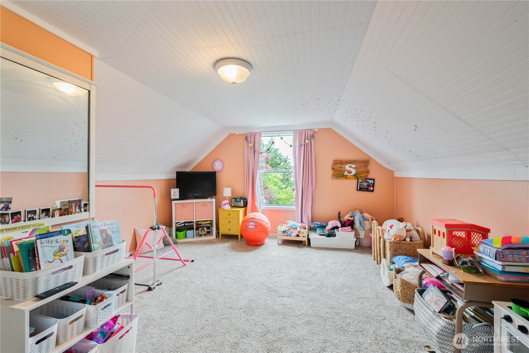 467 19th Avenue Longview, WA 98632 - Photo 21 of 30 a children room with toys and a flat screen tv