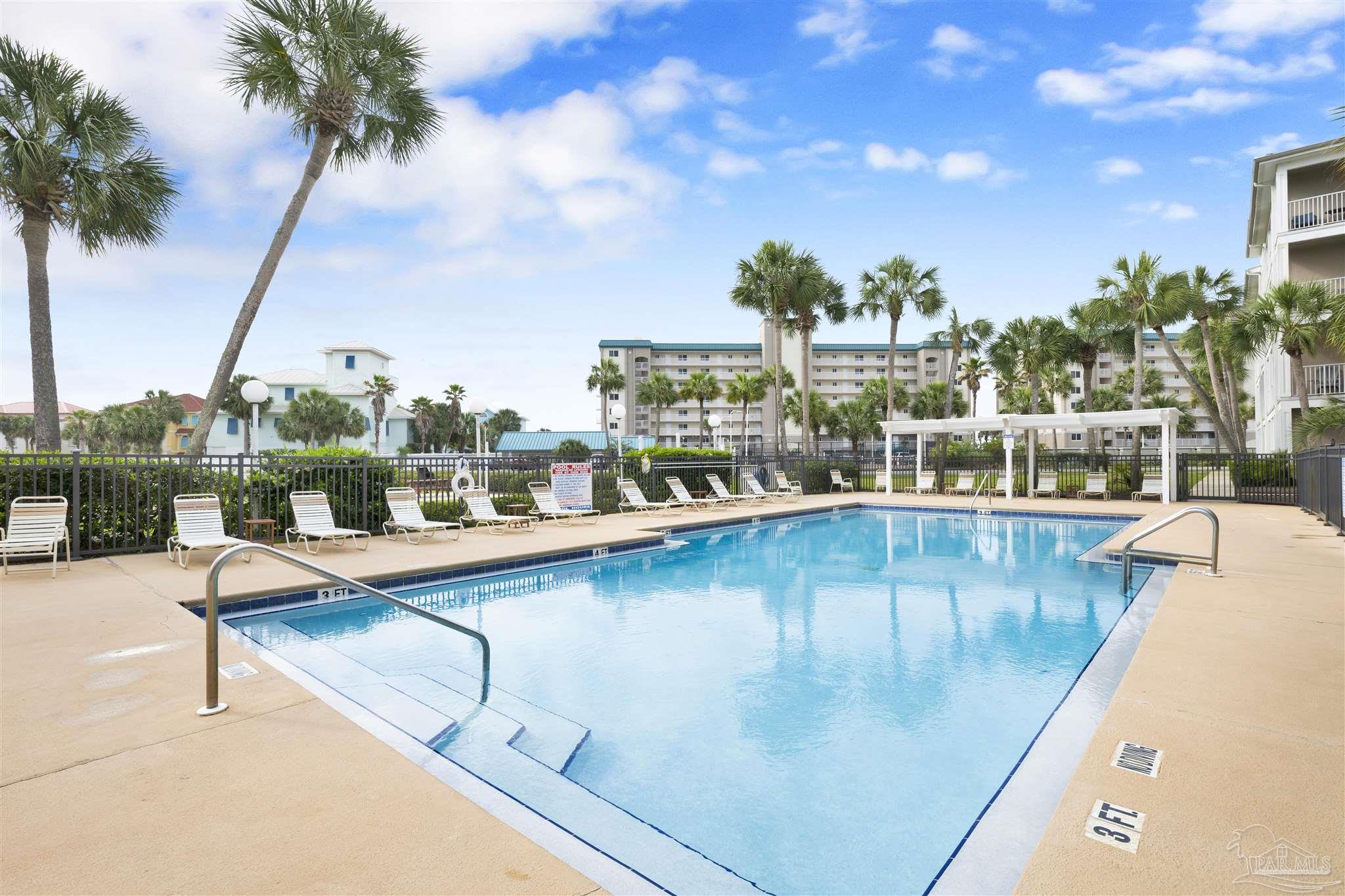 13351 Johnson Beach Road, Unit 203E Perdido Key, FL 32507 - Photo 34 of 55 a view of swimming pool with outdoor seating and city view