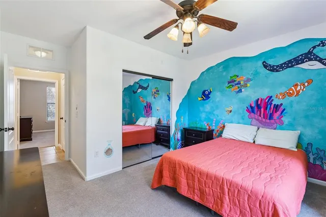 a bedroom with bed and window