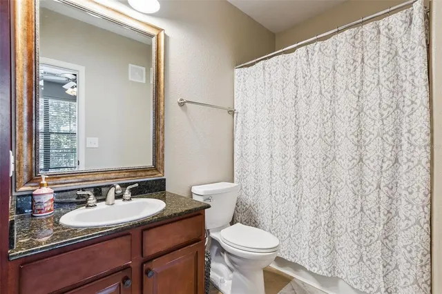 a bathroom with a shower and a bath tub