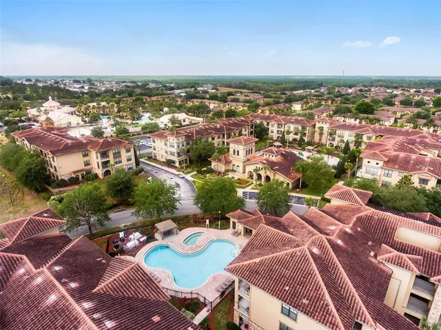 an aerial view of a swimming pool and outdoor space