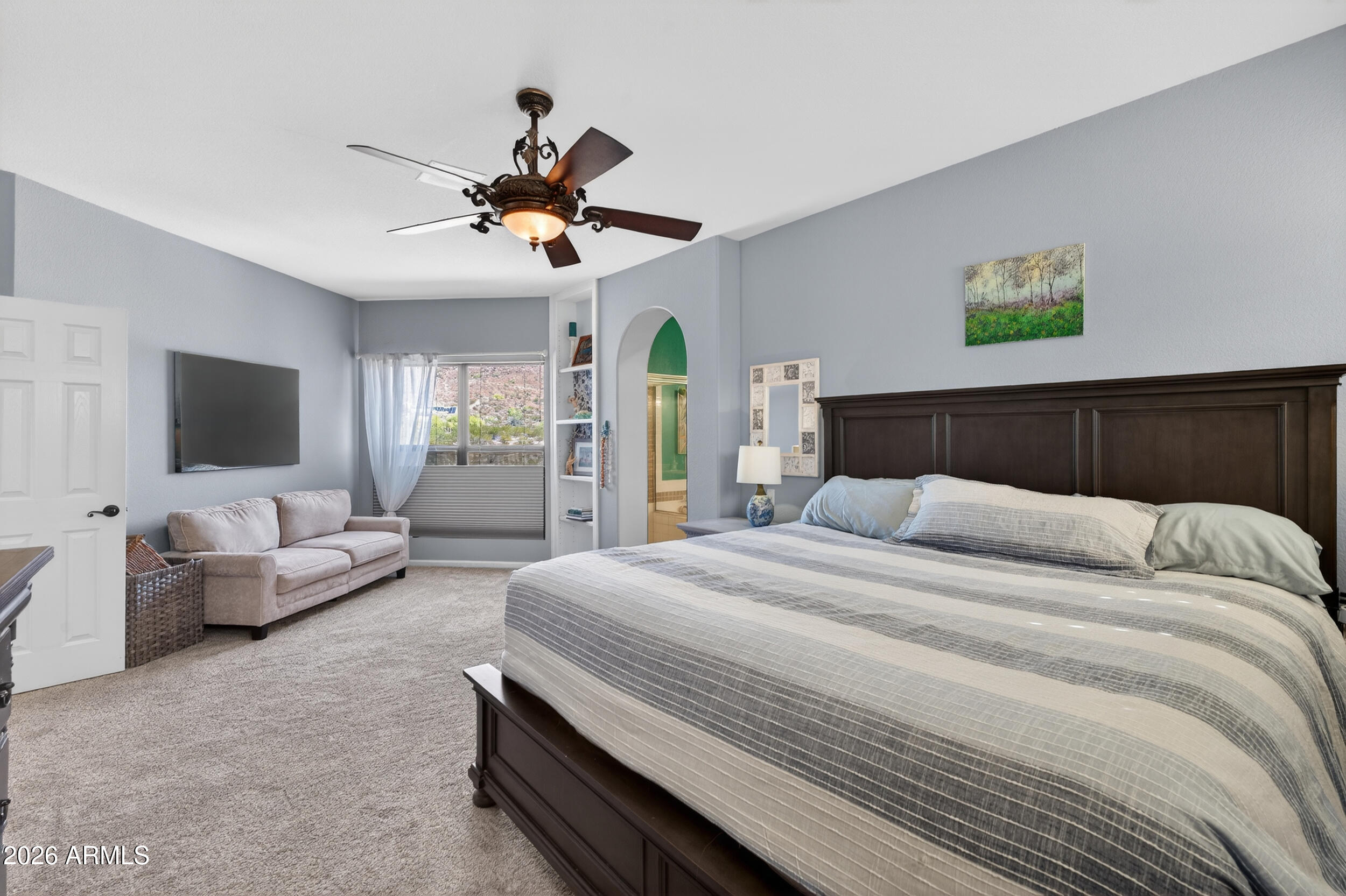 1539 East Winged Foot Road Phoenix, AZ 85022 - Photo 34 of 64 a bedroom with a bed couch and a window