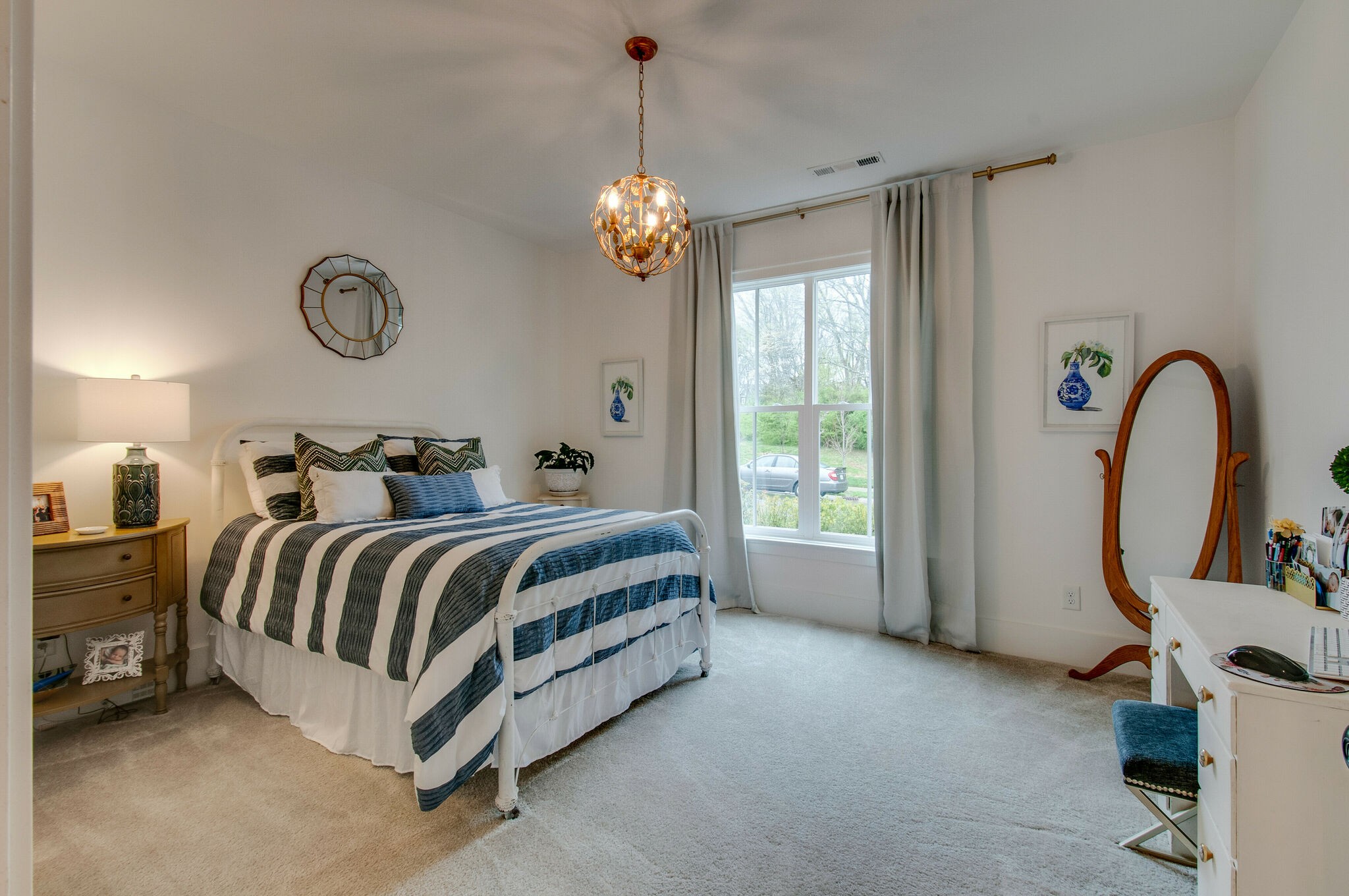 430 Beamon Drive Franklin, TN 37064 - Photo 9 of 62 a bedroom with a bed and a chandelier