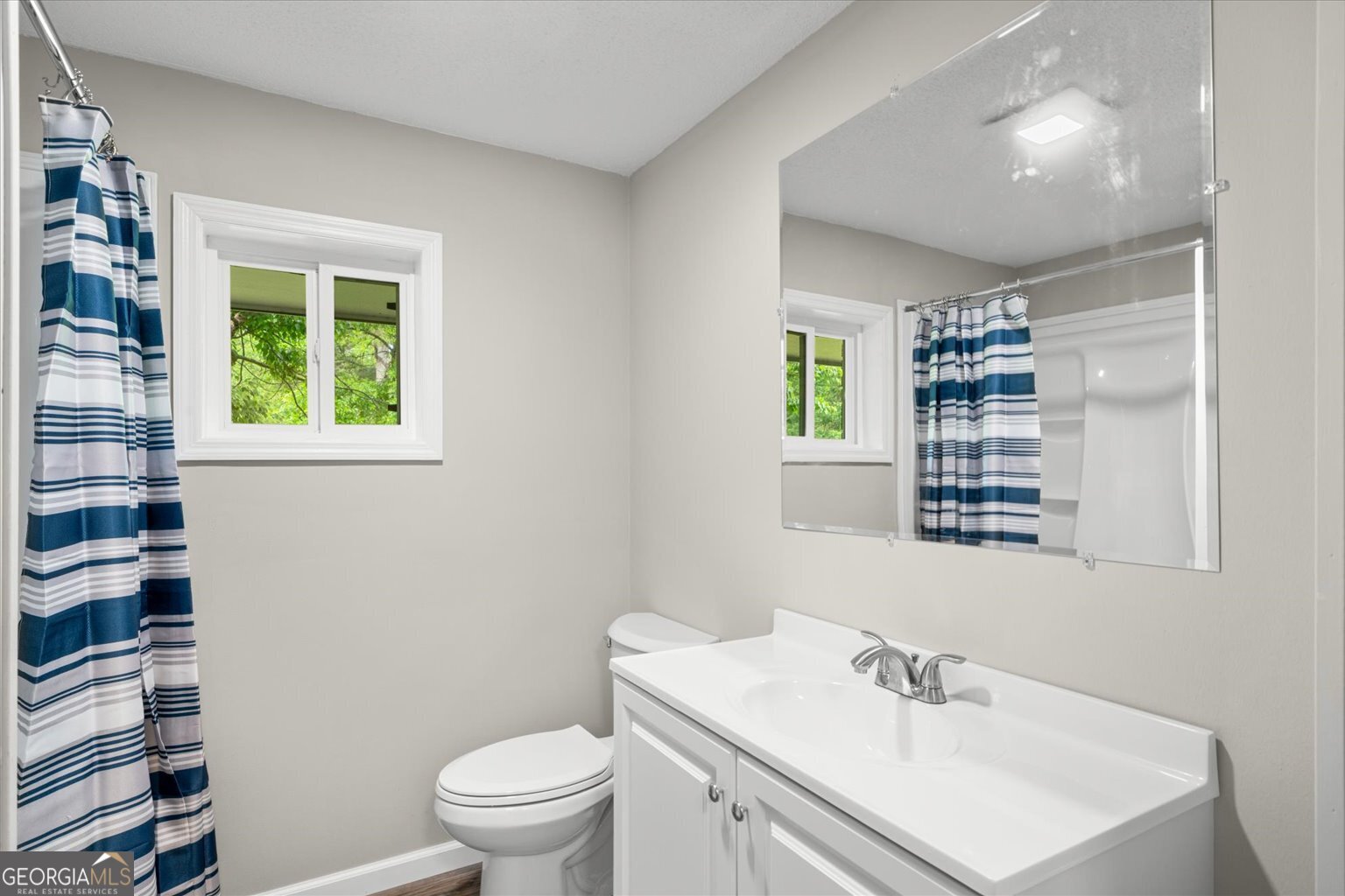 552 Dantzler Circle Dalton, GA 30721 - Photo 13 of 20 a bathroom with a sink a toilet and a window