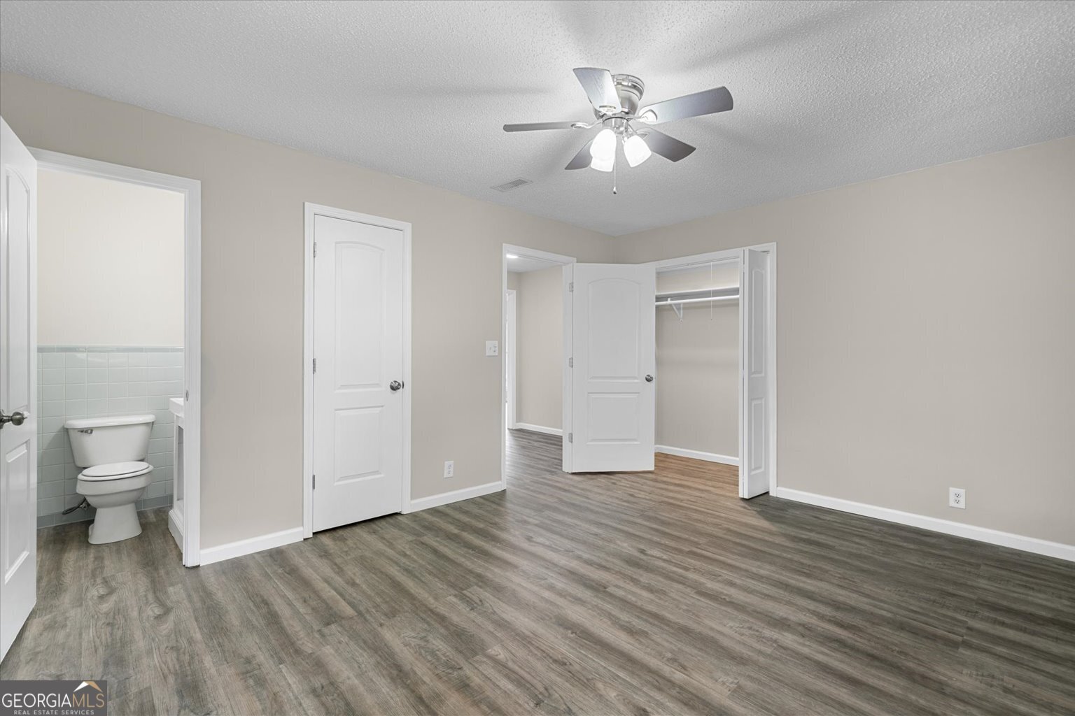 552 Dantzler Circle Dalton, GA 30721 - Photo 15 of 20 wooden floor in an empty room with a bathroom