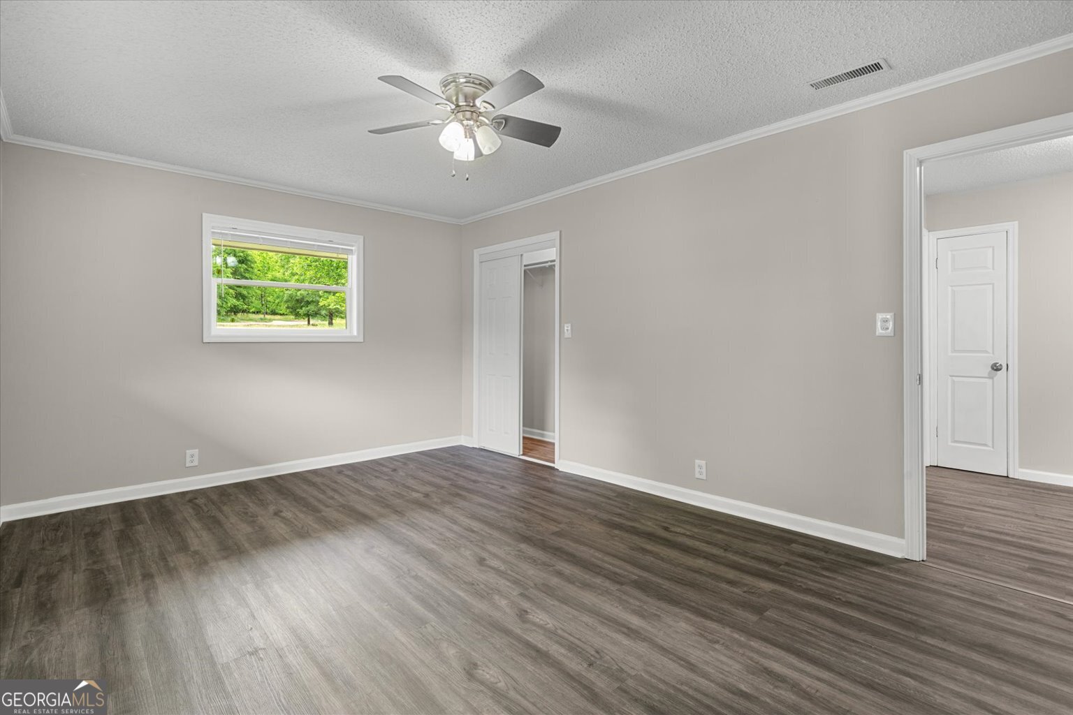 552 Dantzler Circle Dalton, GA 30721 - Photo 16 of 20 an empty room with wooden floor and windows