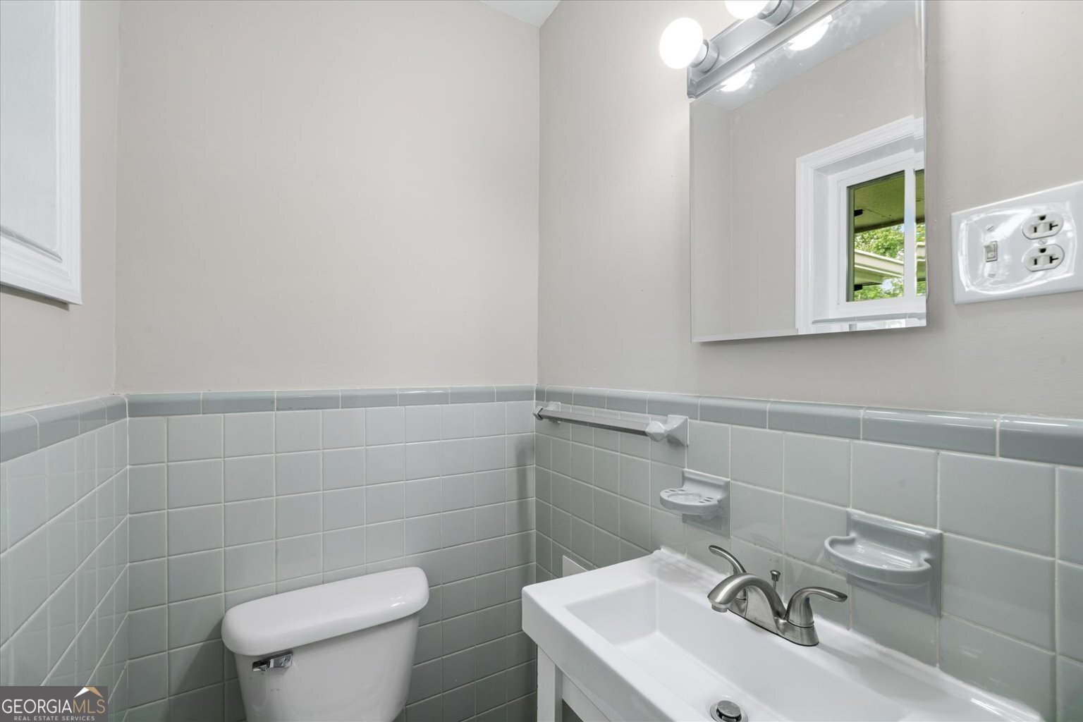 552 Dantzler Circle Dalton, GA 30721 - Photo 17 of 20 a bathroom with a sink a toilet and a mirror