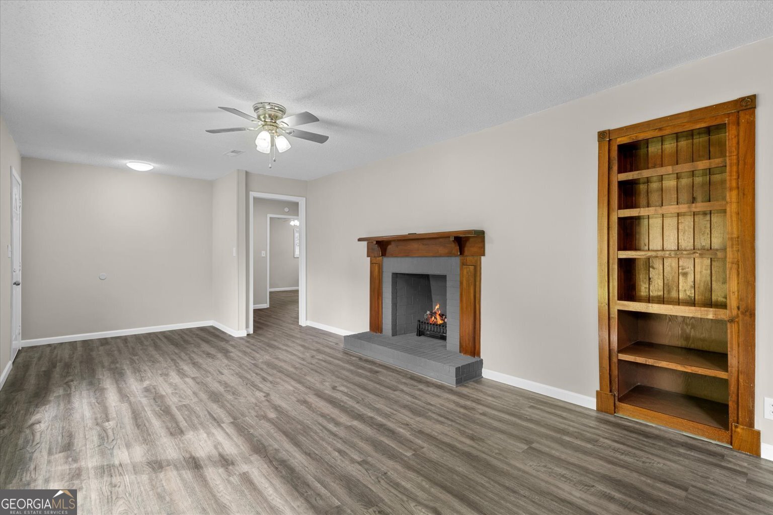552 Dantzler Circle Dalton, GA 30721 - Photo 6 of 20 a view of an empty room with a fireplace and a window