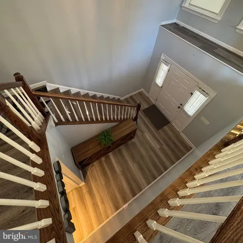 a view of an empty room with window and fireplace