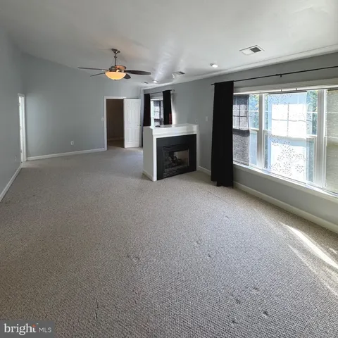 a white bath tub sitting next to a window