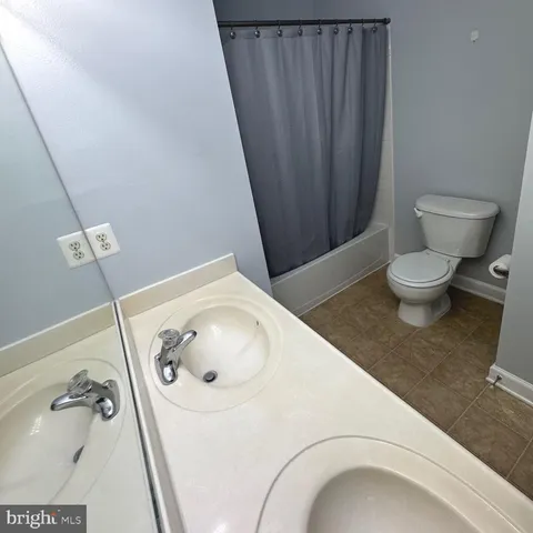 a view of a porch with wooden floor and roof with a barbeque grill