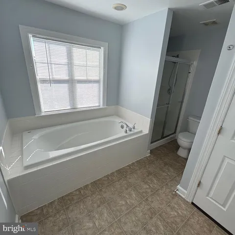 a view of a backyard with a garden