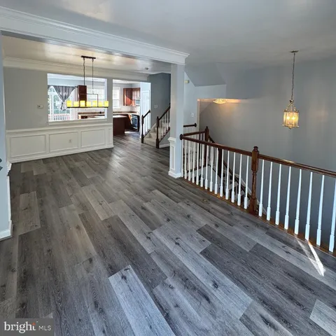 a view of an entryway with wooden floor