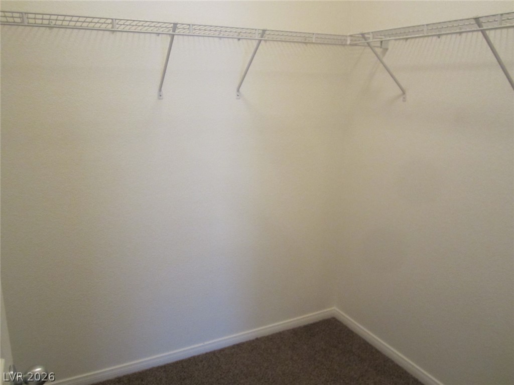 7701 West Robindale Road, Unit 262 Las Vegas, NV 89113 - Photo 26 of 26 Ample storage for an organized home, this Walk-In Closet(s) features wire shelving.