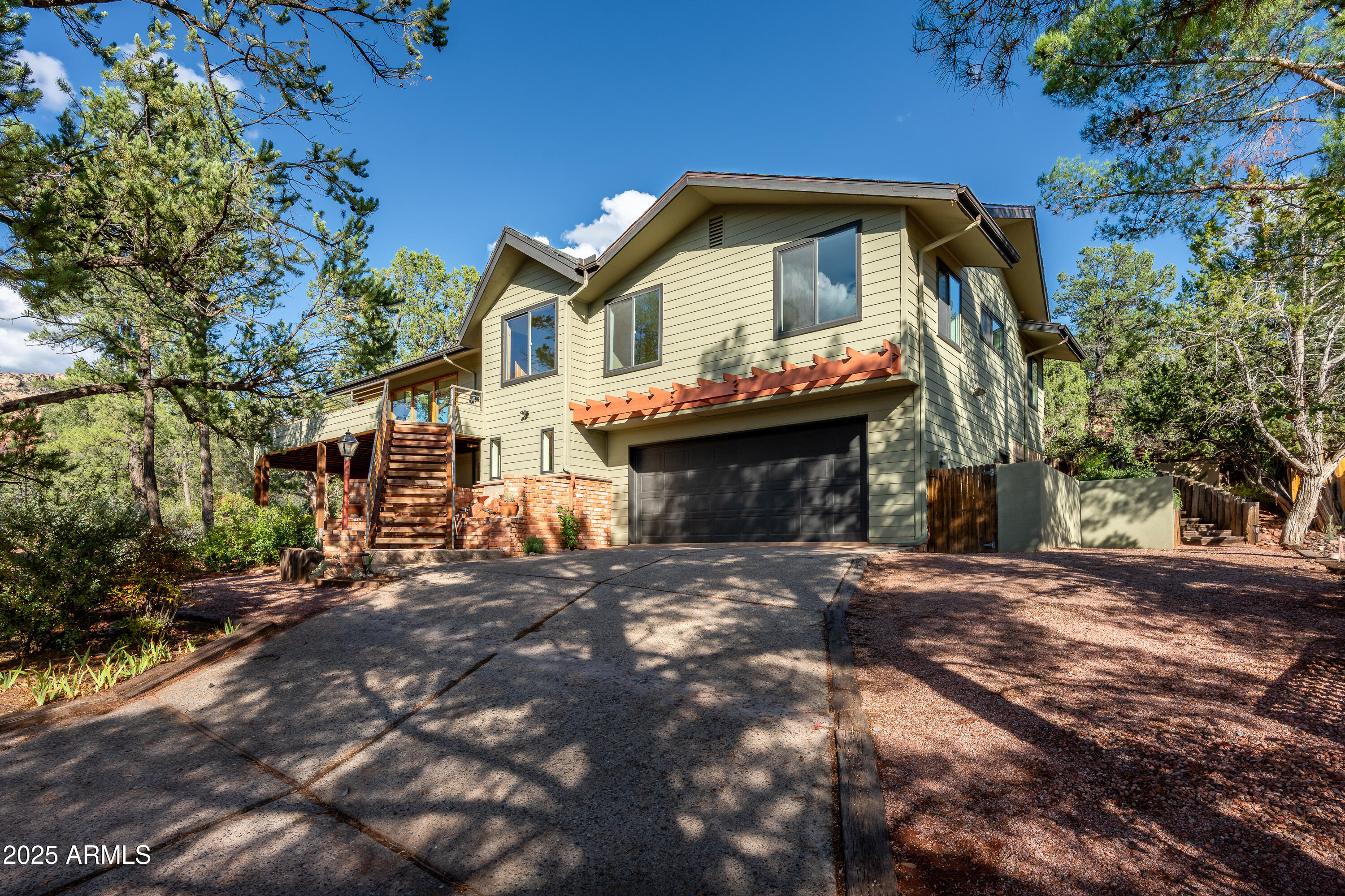 1050 Lee Mountain Road Sedona, AZ 86351 - Photo 19 of 80 a front view of a house with a garden