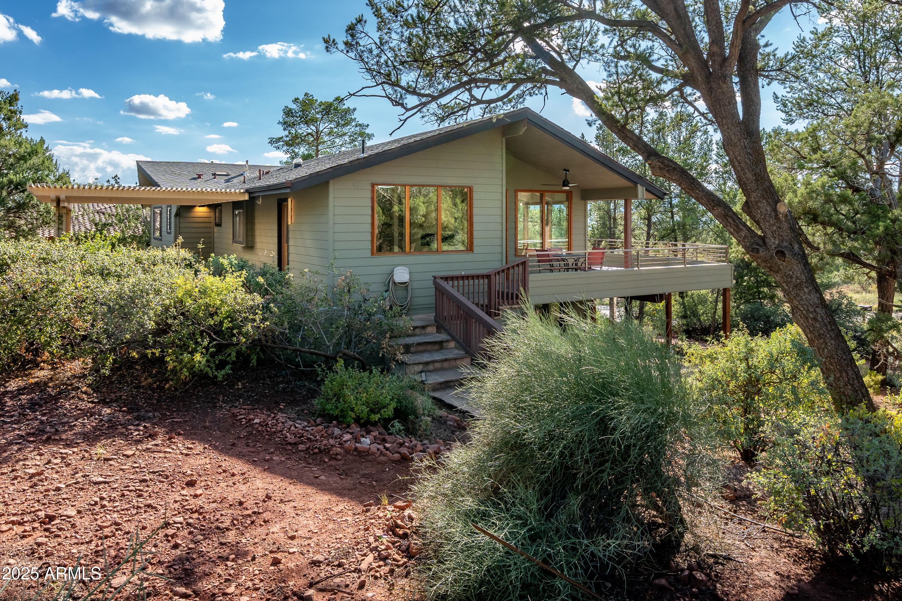 1050 Lee Mountain Road Sedona, AZ 86351 - Photo 27 of 78 a front view of a house with garden