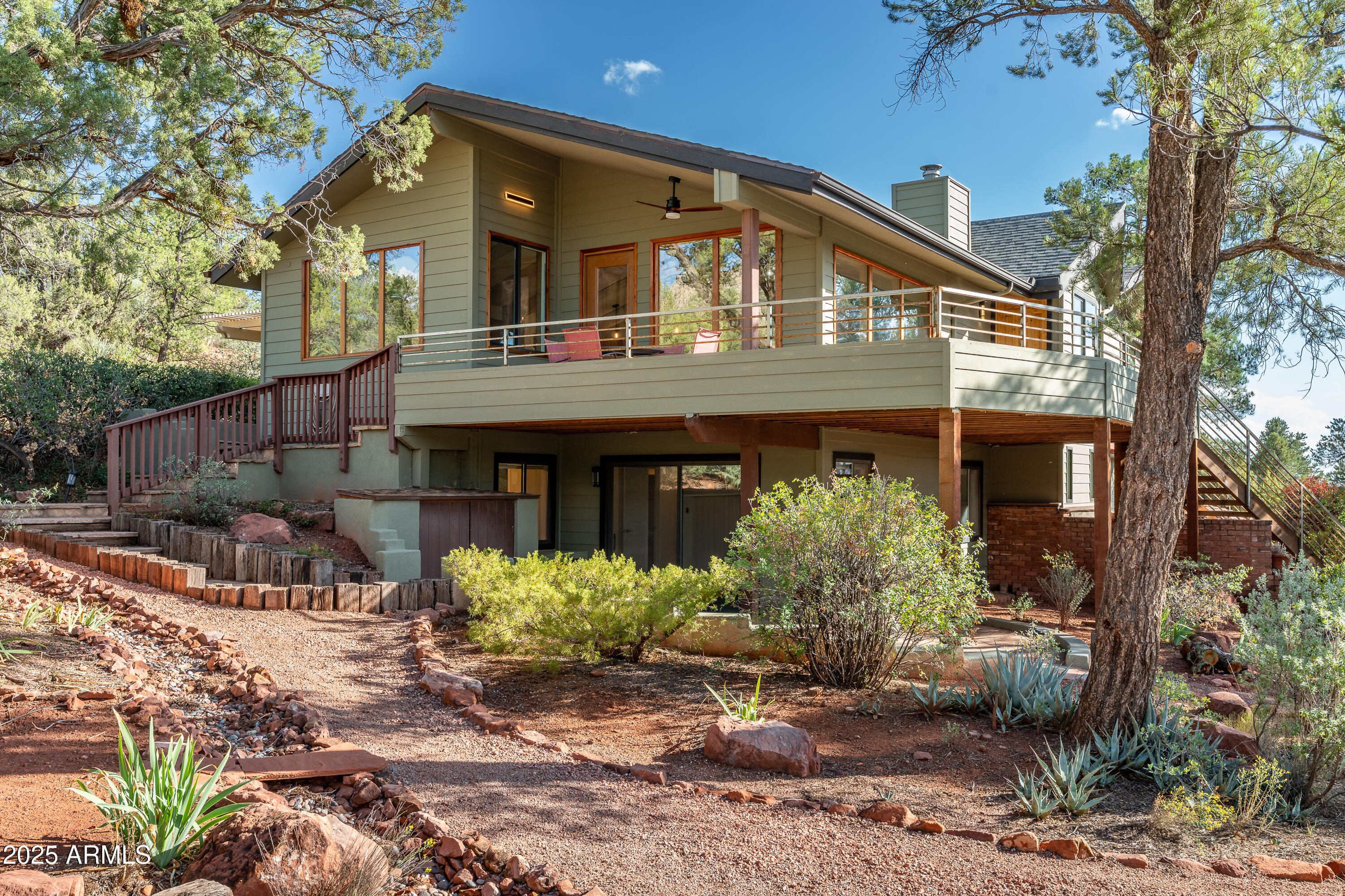 1050 Lee Mountain Road Sedona, AZ 86351 - Photo 26 of 80 a front view of a house with garden