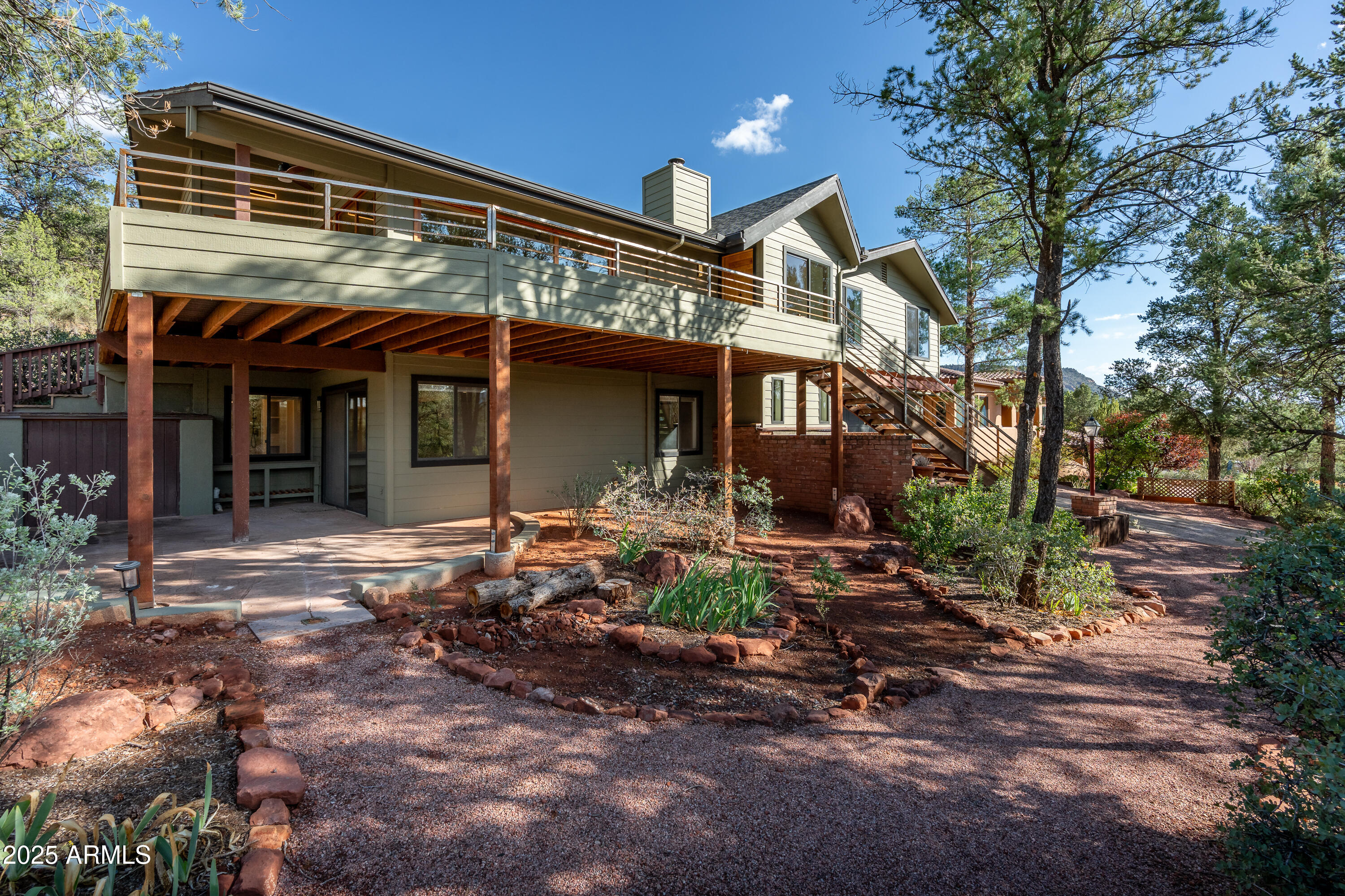 1050 Lee Mountain Road Sedona, AZ 86351 - Photo 28 of 78 a view of a house with backyard porch and sitting area
